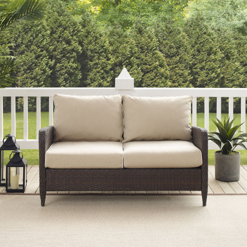 Kiawah Outdoor Loveseat in Brown Resin Wicker & Sand Cushions