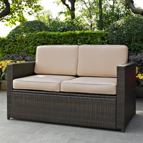 Palm Harbor Outdoor Loveseat in Brown Resin Wicker with Sand Cushions